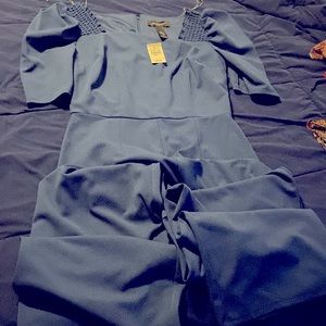 A blue pants jumpsuit that is brand new still with tag